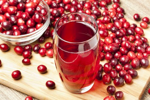 Cranberries and a glass of cranberry juice.