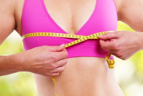 Woman measuring her bust