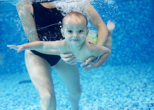 A baby swimming.