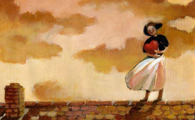 Woman standing on roof with heart in her hands