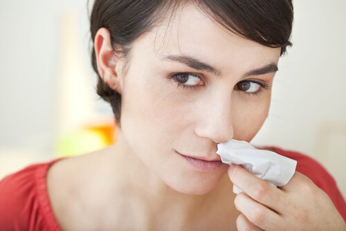 A woman suffering from nosebleeds.
