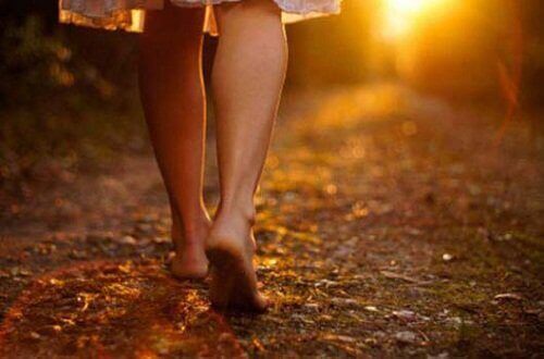 Woman's legs walking on path
