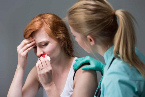 A nurse applying one of the remedies to stop nosebleeds.