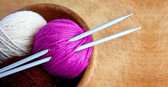 Balls of yarn and knitting needles