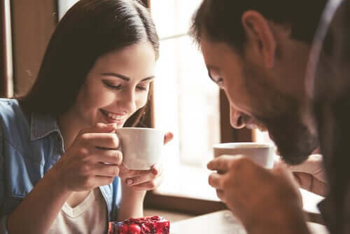 A couple talking and smiling.