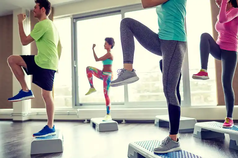 Aerobic exercise class, depicting that exercise will increase blood flow to your brain.