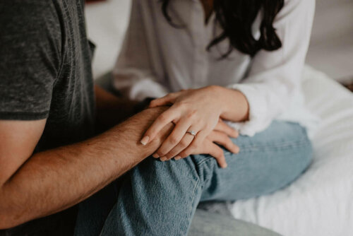 A couple holding hands.