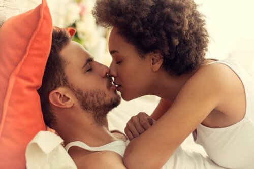 A couple kissing each other.