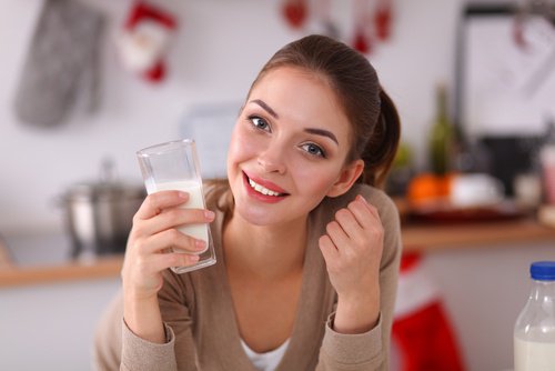 Woman drinking a glass of oatmeal water