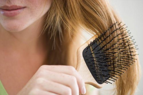 girl brushing her hair