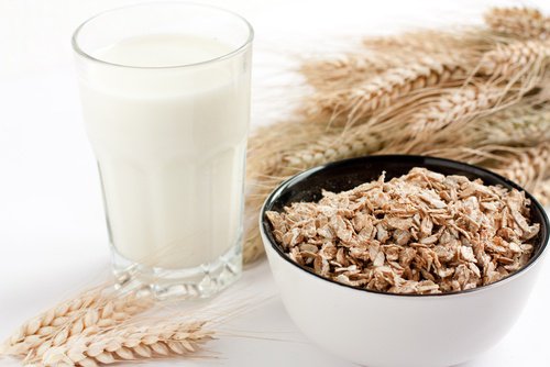 Glass of milk and a bowl of oatmeal