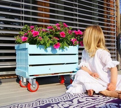 Pot stand made from a crate.