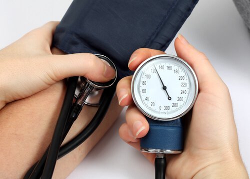 A person getting his blood pressure checked.