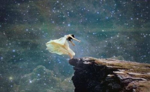 Woman on the edge of a cliff