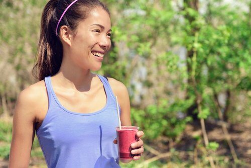 An athlete drinking beet juice.