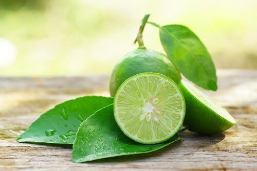 A cut lime and a whole lime.
