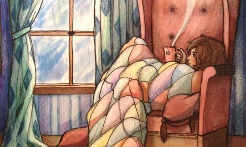 Girl sitting on a chair drinking a hot drink.