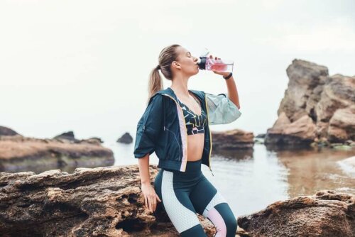 A woman drinking water.