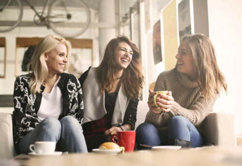 Some friends with good self-esteem having fun at a coffee shop.