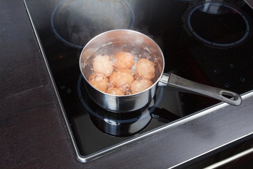 boiling eggs in a pot