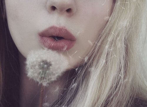 girl-blowing-dandelion