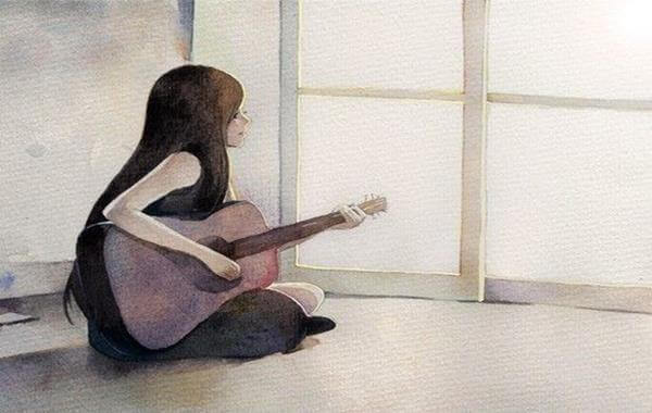 A girl with a guitar.