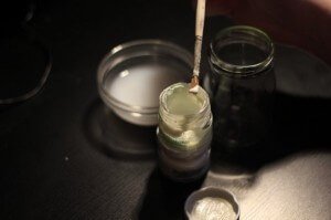 mixing paint with a paintbrush