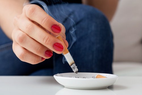 Woman putting of a cigarette