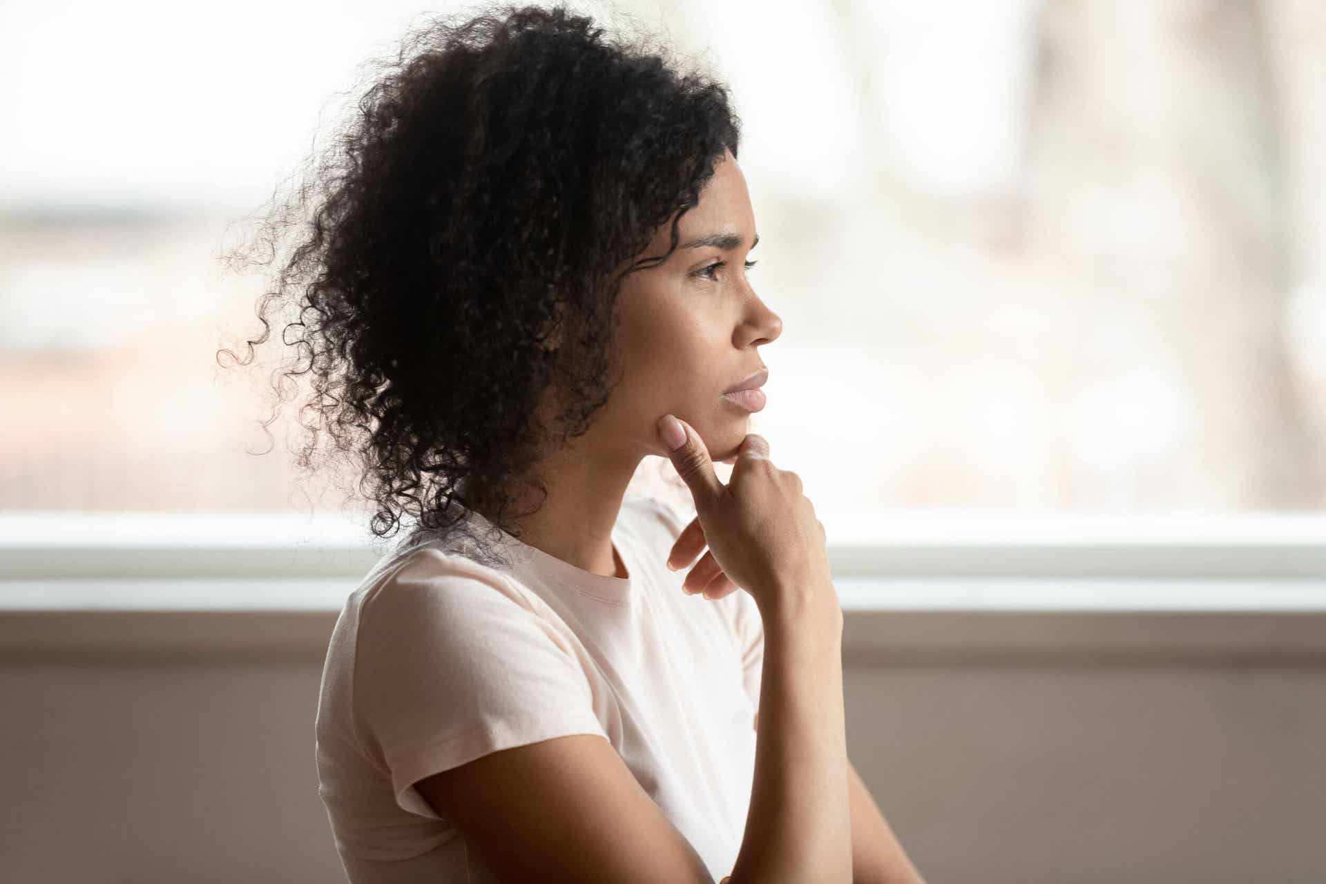 A woman looking contemplative.