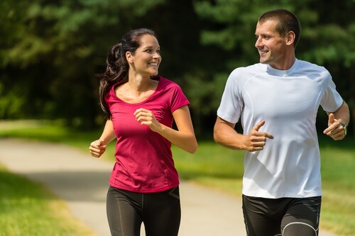 A couple running together.