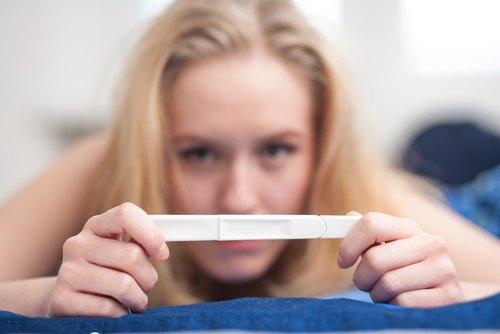 Woman with pregnancy test