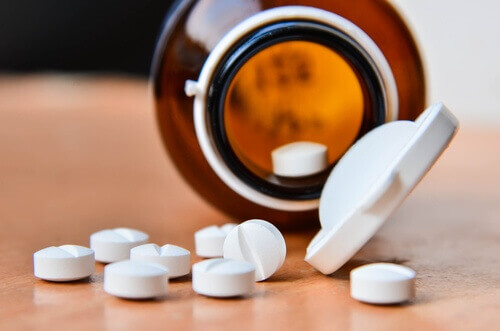 Bottle of aspirin tablets aspirin to remove calluses