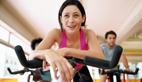 Woman on a bicycle experiencing sport induced orgasms