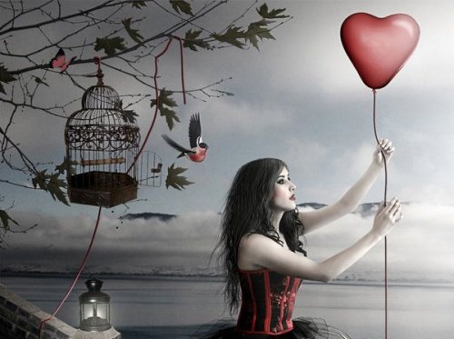 woman holding heart shaped balloon