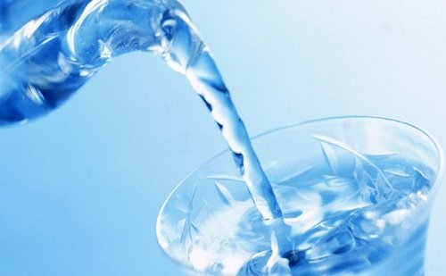 Pouring water in a glass