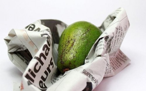 A fruit inside a newspaper sheet.