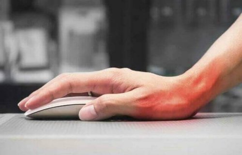 Person grabbing wrist pain