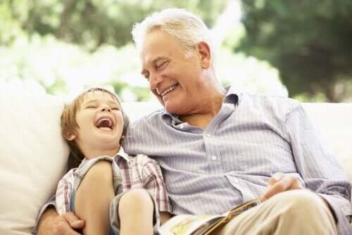 A grandfather and grandson laughing together.