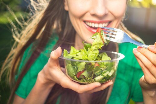 woman eating salad