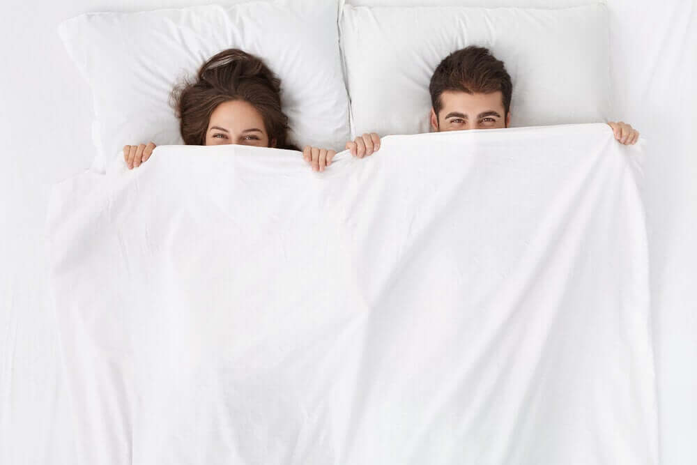 A couple sleeping on their backs.