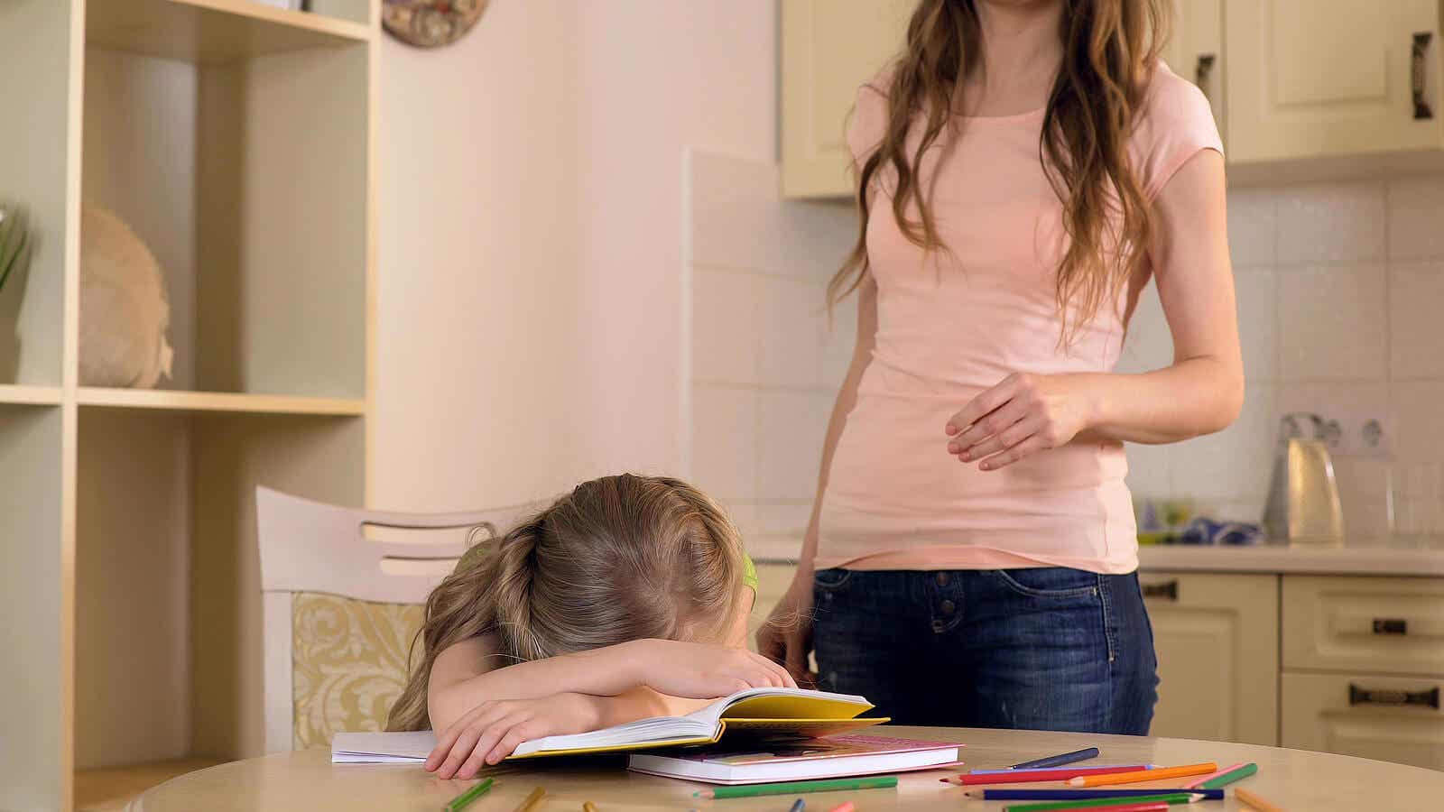 A young girl feeling frustrated while doing her homework.