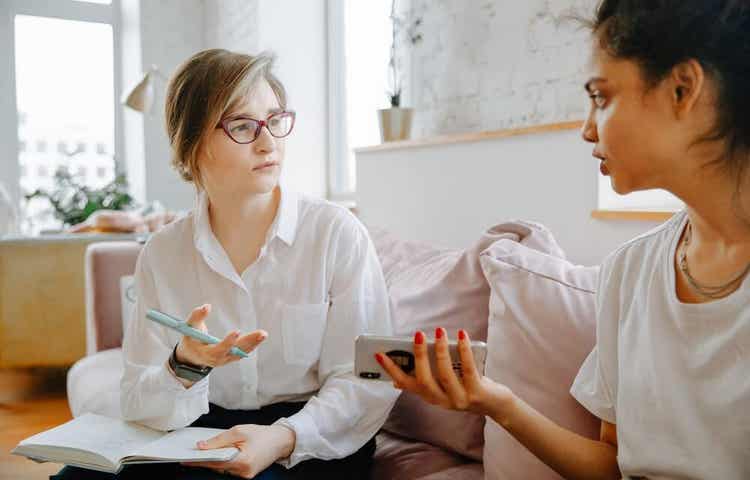 Two woman having a conversation.