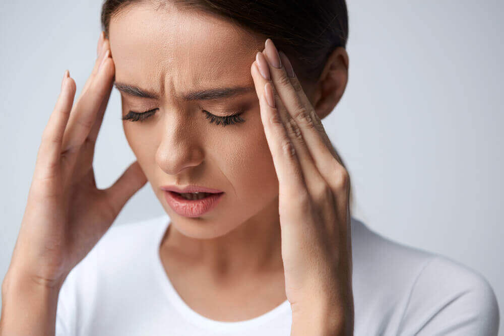 A woman with a migraine.