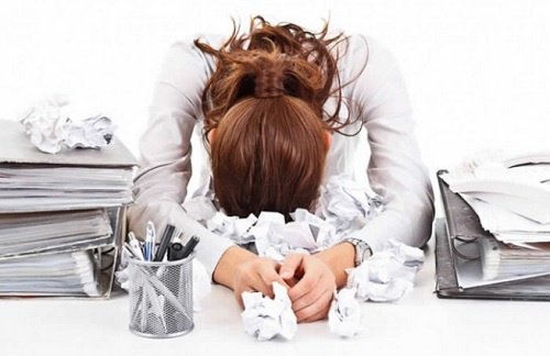 A woman who is stressed at work.