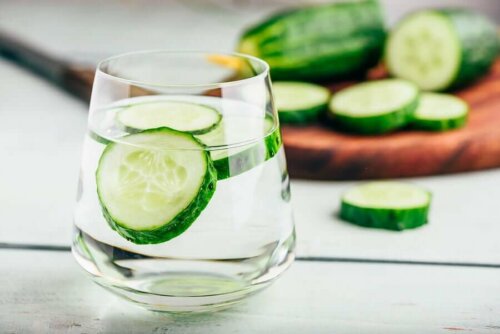 A glass of water with cucumber.