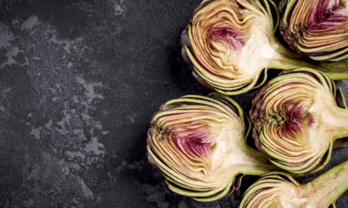 A group of halved artichokes.