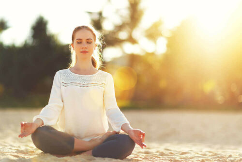 A woman meditating.