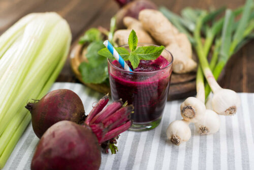 beet shake on a table with beets and onions