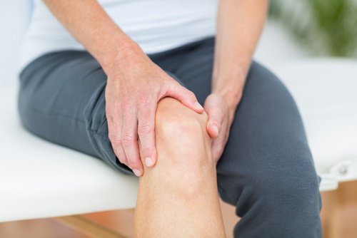 Person holding knee