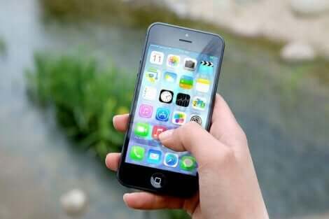 A hand holding a cellphone.